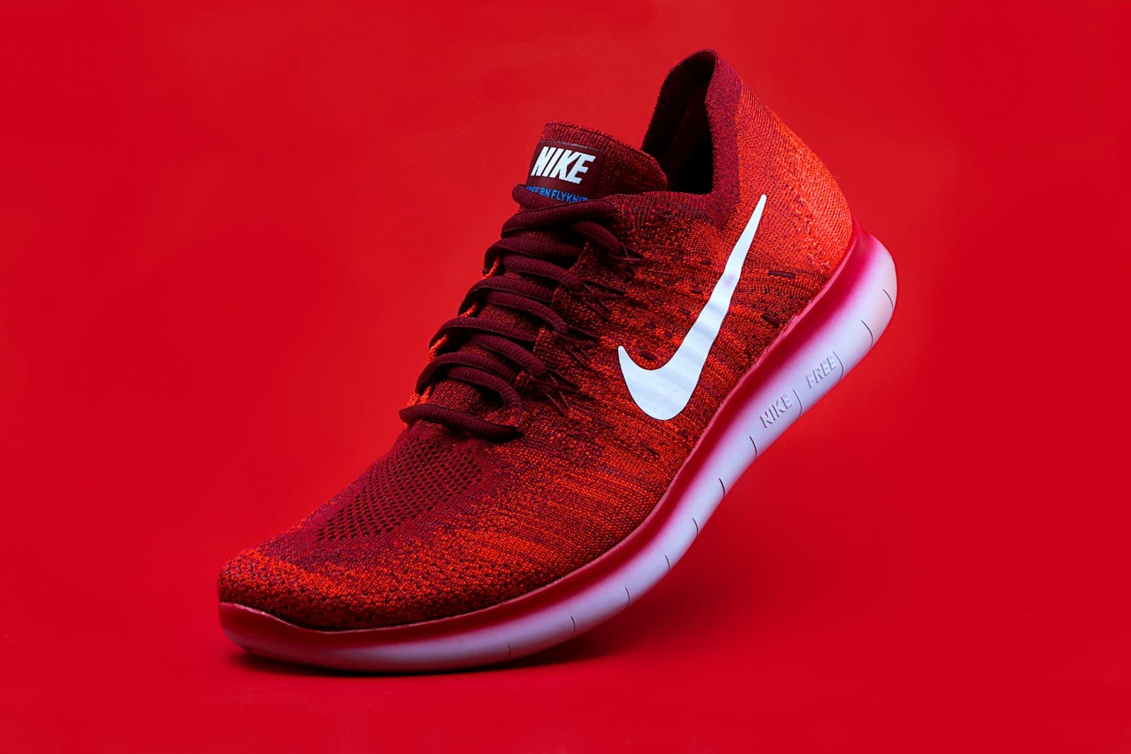 Flyknit Runner — Crimson
